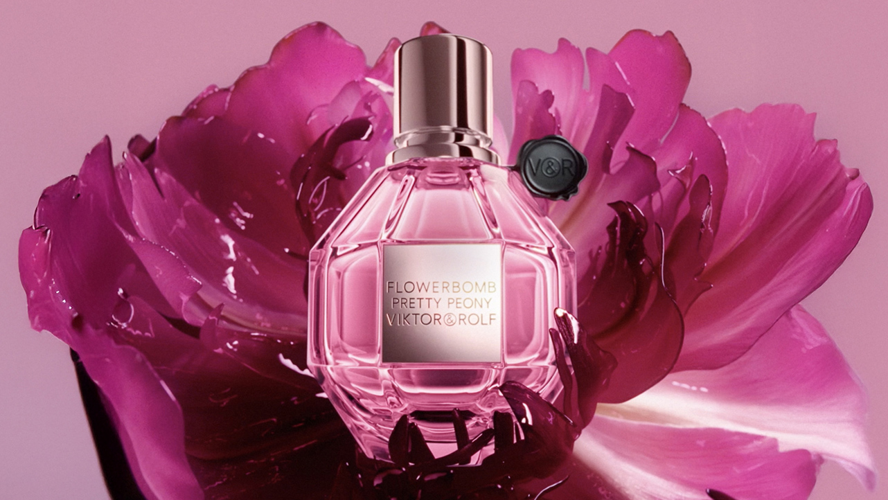 Flowerbomb Pretty Peony campaign still with pink petals and perfume bottle
